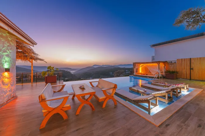 Couple dining on a luxury balcony with a view of the Eiffel Tower at night